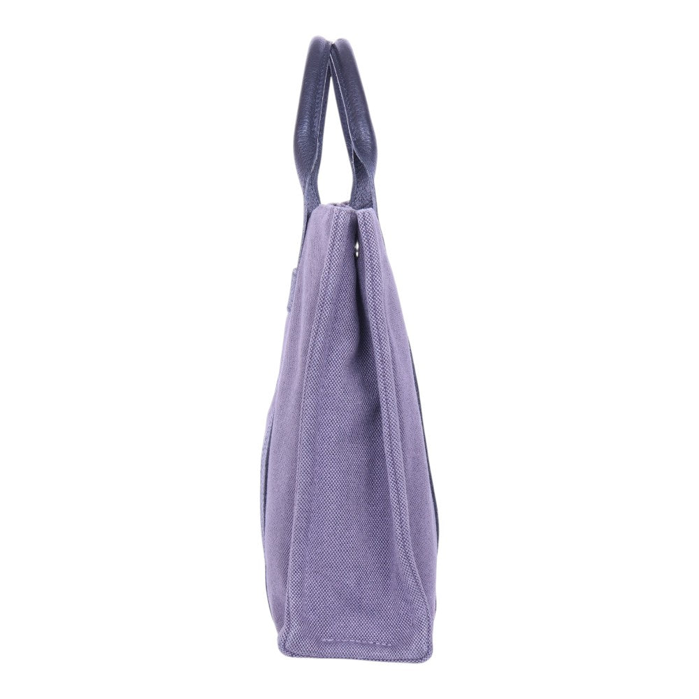 Hermès Fourre Tout MM canvas paars, smalle zijkant met hengsel