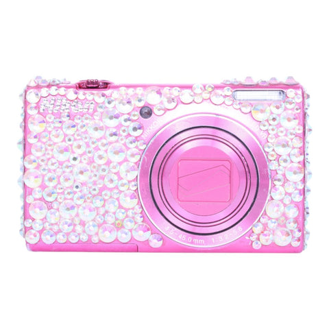 Nikon Coolpix S6200 compactcamera, roze, versierd met strass, voorkant met gesloten lens, tweedehands