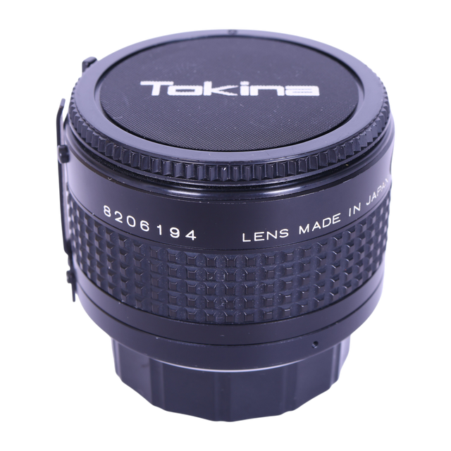 Tokina RMC 2x Doubler teleconverter voor Minolta M/MD, zijkant met Tokina-dop en serienummer, tweedehands