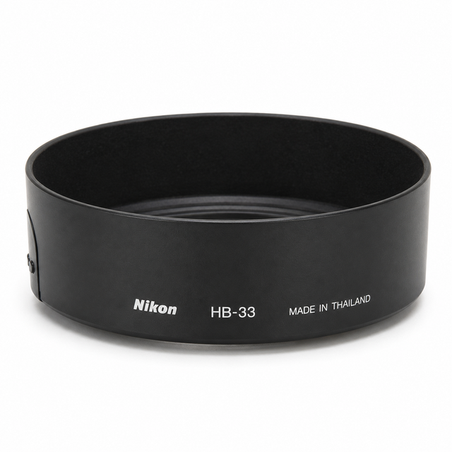 Nikon HB-33 zonnekap, zwart, zijkant met opdruk HB-33