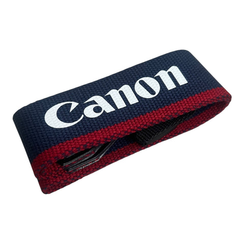Canon vintage camera nekriem 3,5 cm, donkerblauw met rode rand en witte Canon-letters