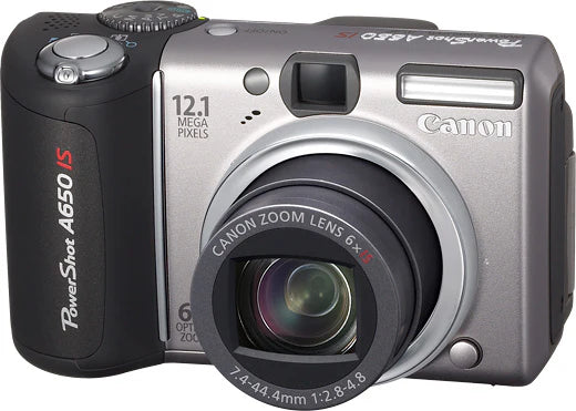Canon PowerShot A650 IS digitale compactcamera, zilver, voorkant met 6x zoomlens en zwarte handgreep, tweedehands
