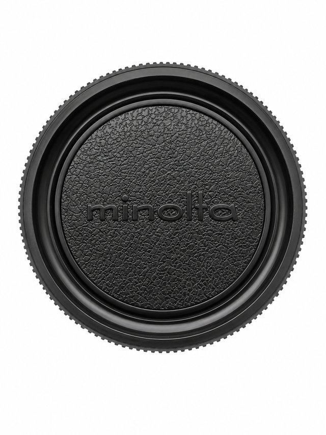 Minolta MC/MD-mount body cap lederlook, zwart met minolta-logo en geribbelde rand, voorkant