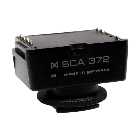 Metz SCA 372 M hotshoe-adapter voor Pentax analoge camera's, zwarte adapter met opschrift SCA 372 M made in germany