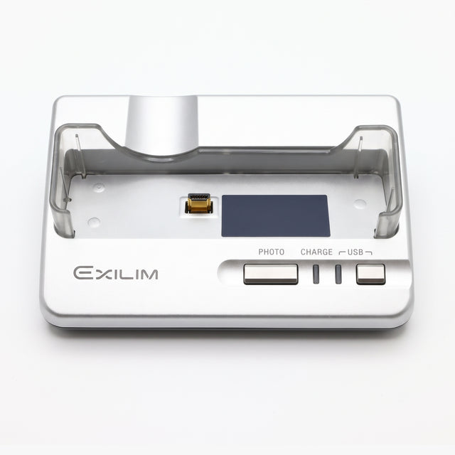 Casio Exilim USB cradle CA-27 voor EX-Z57, zilver laadstation met transparante houder en PHOTO-, CHARGE- en USB-knop, tweedehands